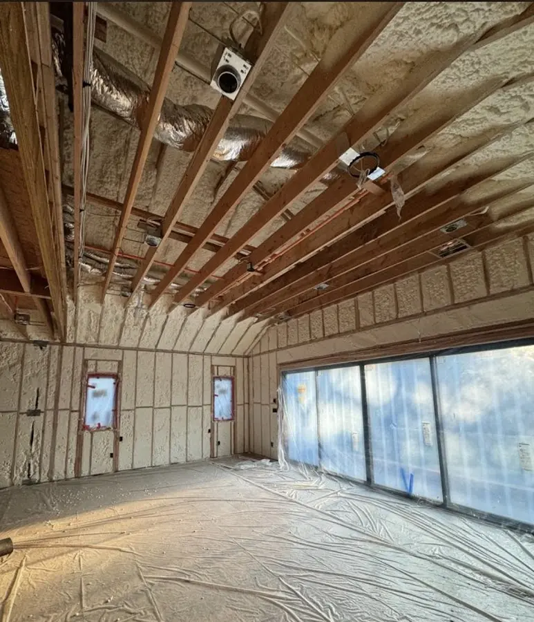 Interior walls and ceiling insulated with spray foam during new construction in Little Falls